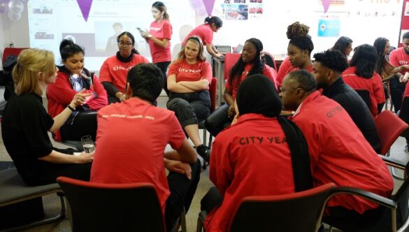 Group of volunteer mentors sitting in a circle